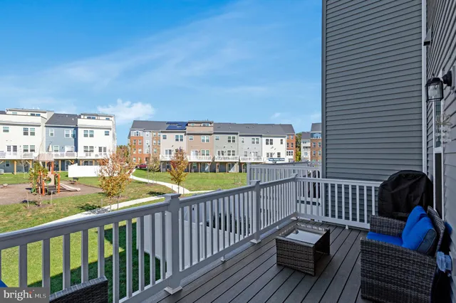 a view of a balcony with wooden floor