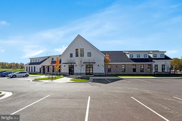 a view of house with outdoor space and swimming pool