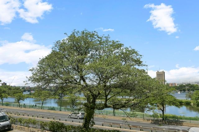 a view of a yard in front of the house with green space