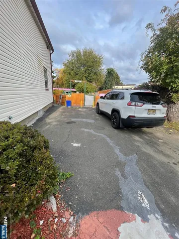a view of street with parked cars