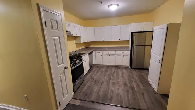a kitchen with a refrigerator a sink and dishwasher