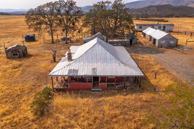 an aerial view of a house having patio