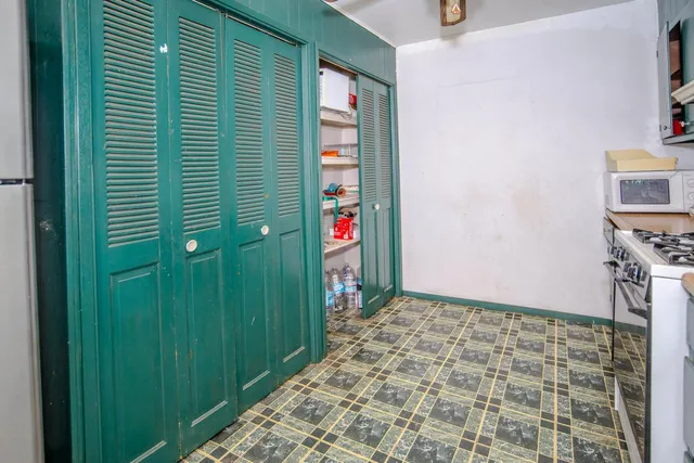 a dining room with furniture and a chandelier
