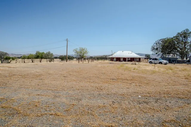 a front view of a house with yard