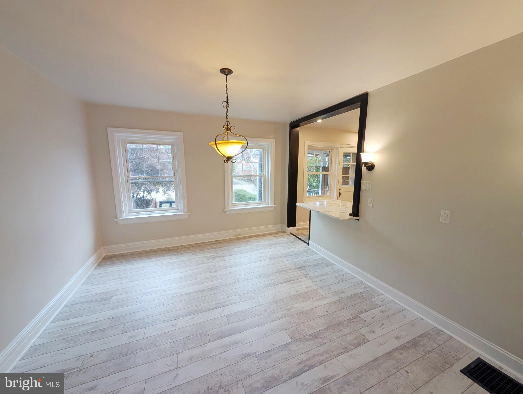 1322 Garfield Avenue Reading, PA 19610 - Photo 4 of 10 a view of a room with window wooden floor and mirror