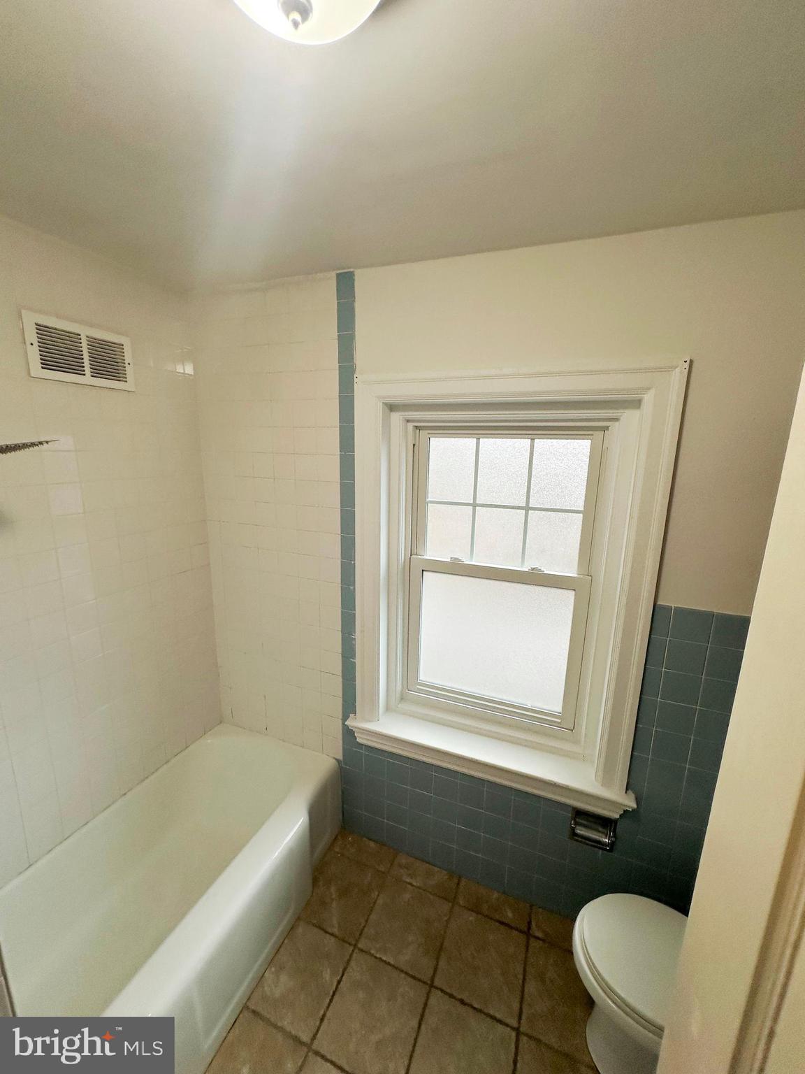 1322 Garfield Avenue Reading, PA 19610 - Photo 10 of 10 a bathroom with a bathtub and window