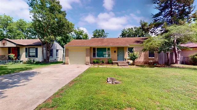 a front view of a house with swimming pool having outdoor seating