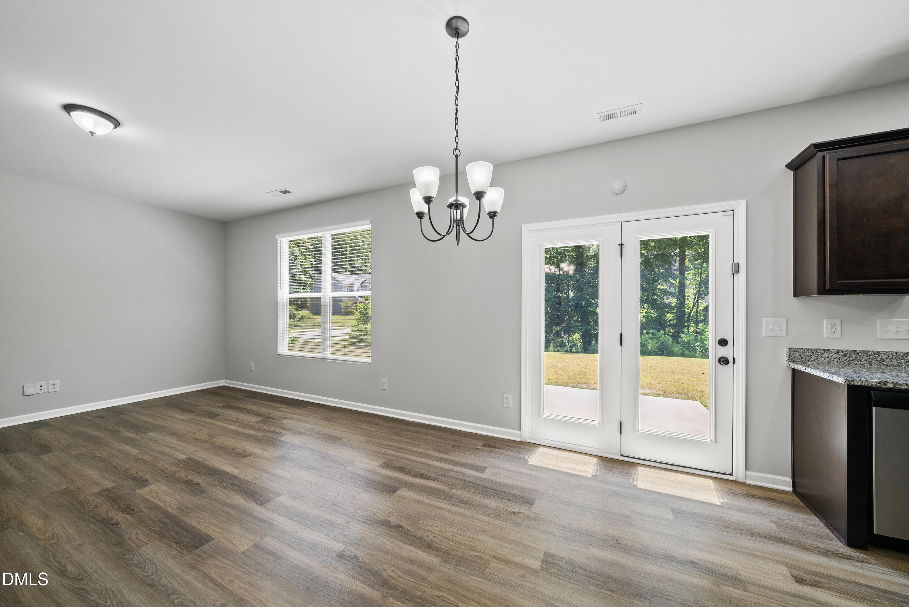 2816 Elsa Drive Raleigh, NC 27610 - Photo 14 of 35 a view of an empty room with window and chandelier