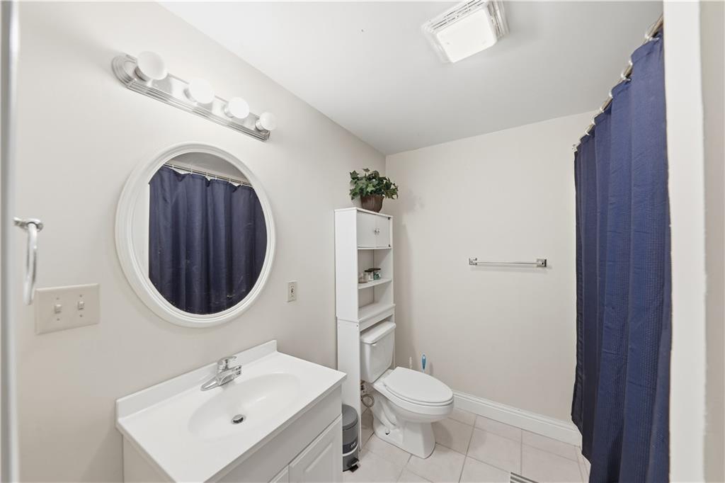 260 Tabor Forest Drive Oxford, GA 30054 - Photo 16 of 20 a bathroom with a sink a mirror and toilet