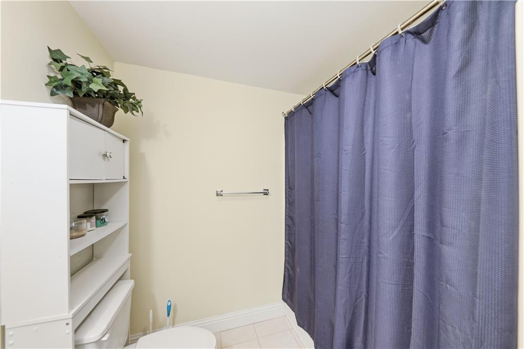260 Tabor Forest Drive Oxford, GA 30054 - Photo 17 of 20 a bathroom with a toilet and a shower curtain