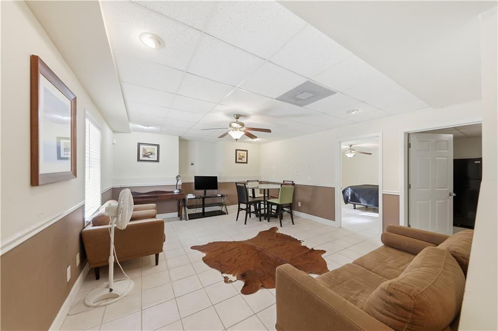 260 Tabor Forest Drive Oxford, GA 30054 - Photo 8 of 20 a living room with furniture potted plant and a window