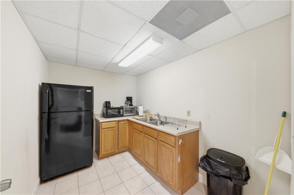 260 Tabor Forest Drive Oxford, GA 30054 - Photo 10 of 20 a kitchen with a stove top oven and refrigerator