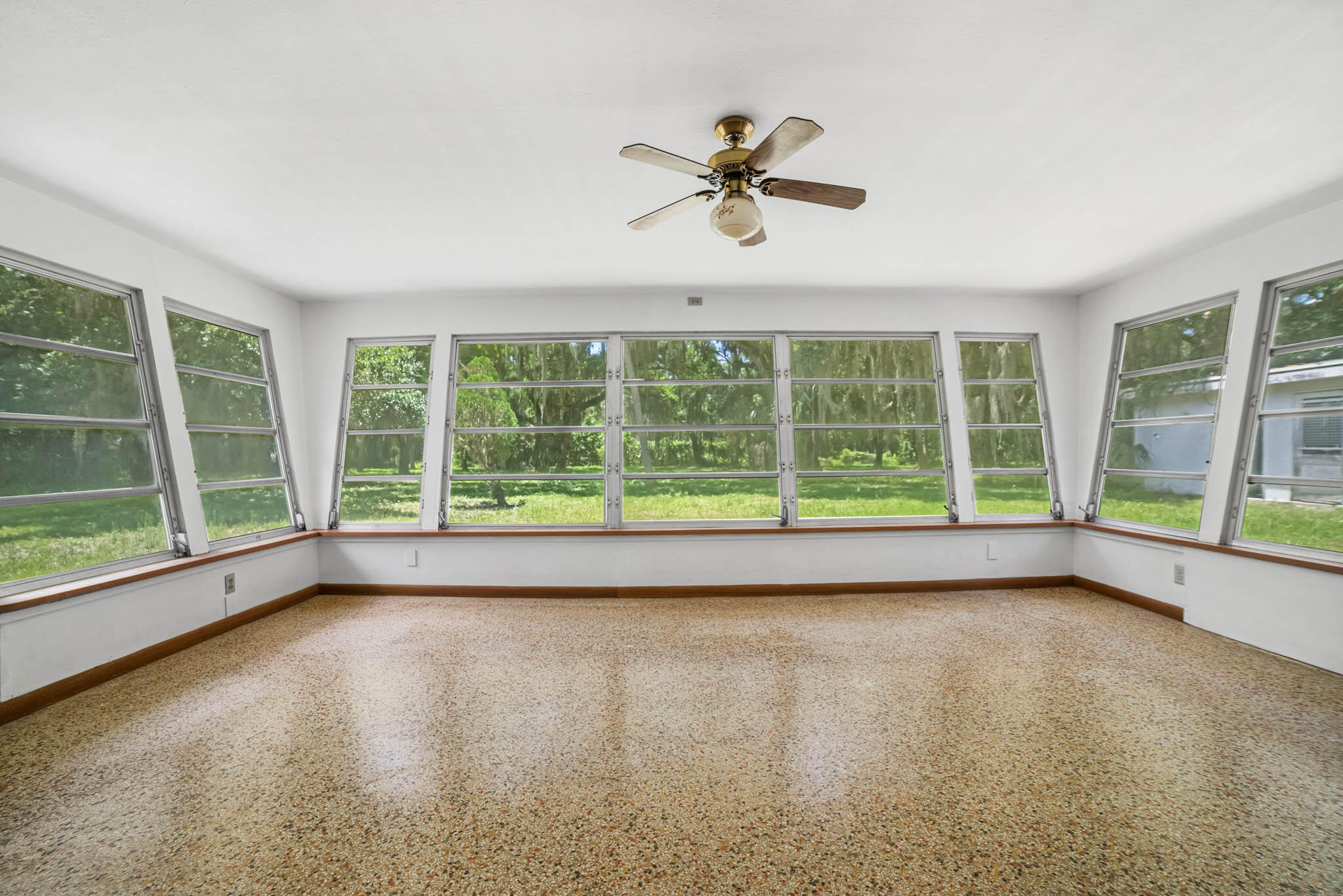 409 Southwest 15th Street Okeechobee, FL 34974 - Photo 9 of 14 a view of room with window and a ceiling fan