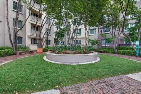 a view of a building with a yard