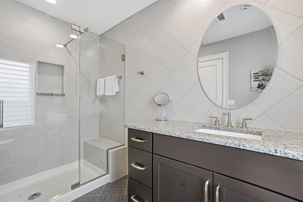 931 Pleasant Hill Road Wexford, PA 15090 - Photo 31 of 50 a bathroom with a granite countertop sink a mirror and shower