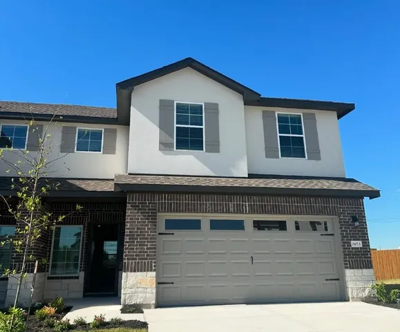 a front view of a house with windows