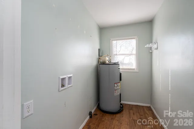 a room with wooden floor and a window
