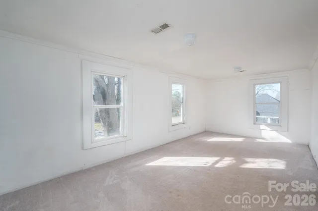 an empty room with windows