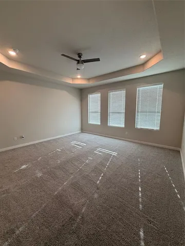 a large white kitchen with a sink stainless steel appliances and cabinets