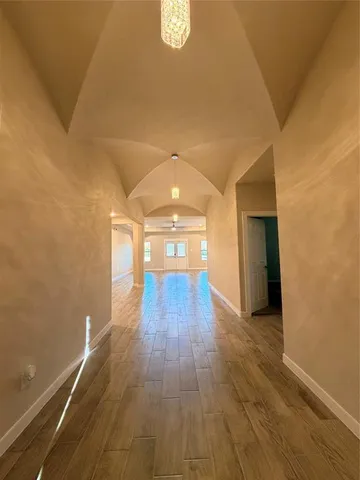 a view of gallery with wooden floor