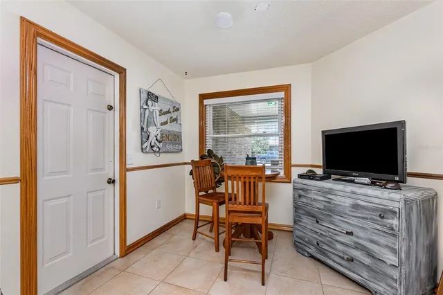 a view of a livingroom with furniture and a flat screen tv