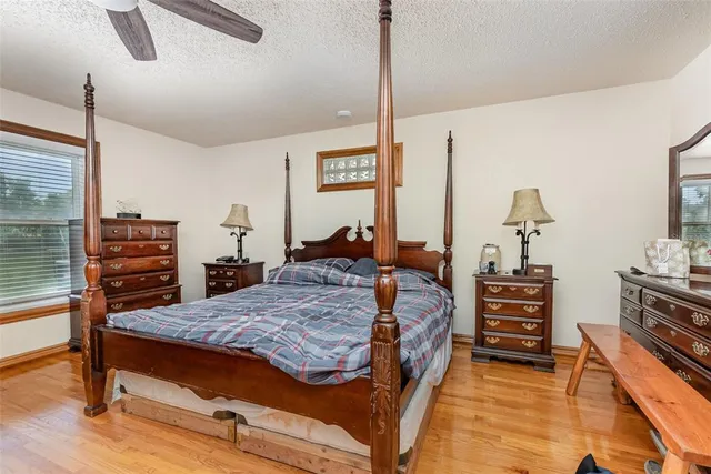 a bed room with a bed window and a table