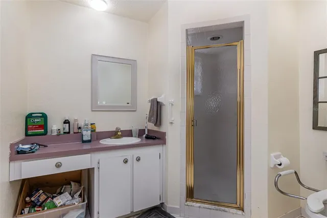 a bathroom with a sink a vanity and mirror