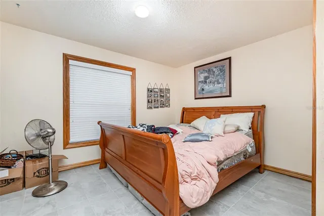 a room with bed and window