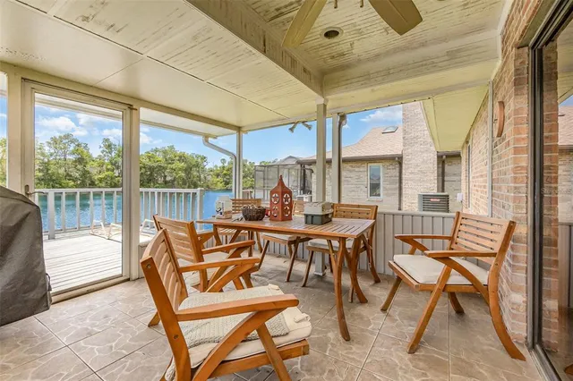 a view of a dining room with furniture wooden floor and a chandelier