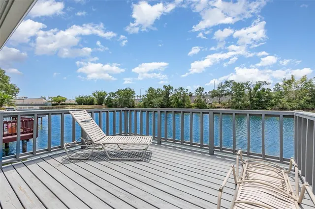 a view of deck with wooden floor and fence