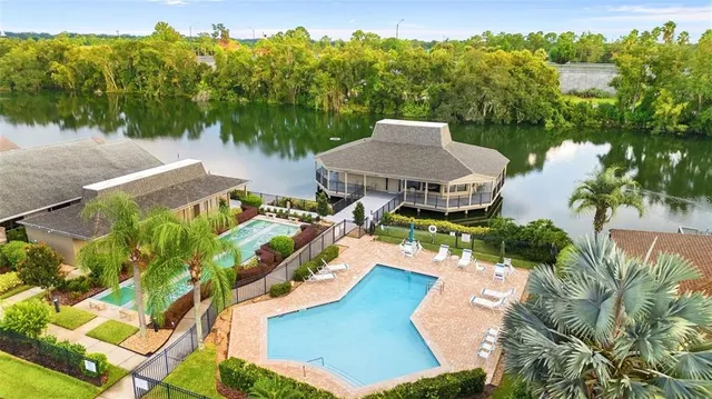 an aerial view of a house with garden space and street view