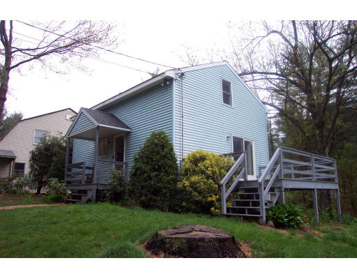 8 Skinners Road Groton, MA 01450 - Photo 1 of 21 a front view of a house with a garden