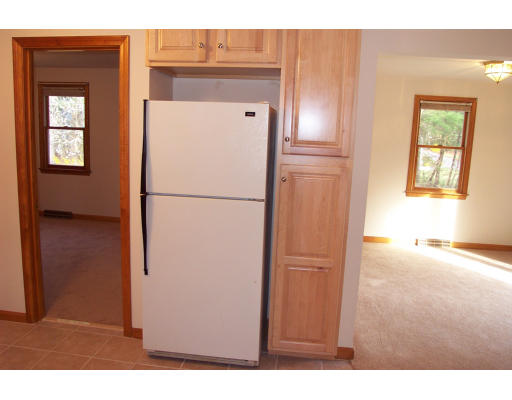 8 Skinners Road Groton, MA 01450 - Photo 12 of 21 a view of kitchen with a refrigerator cabinet and a microwave