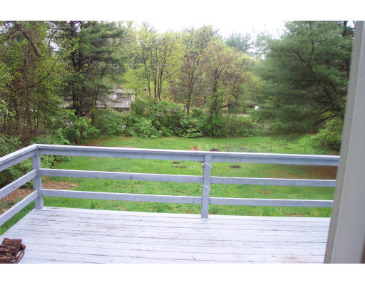 8 Skinners Road Groton, MA 01450 - Photo 14 of 21 a green field with trees in the background