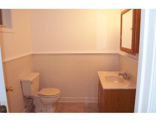 8 Skinners Road Groton, MA 01450 - Photo 17 of 21 a bathroom with a sink a toilet and mirror