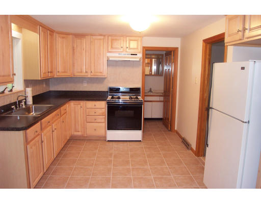 8 Skinners Road Groton, MA 01450 - Photo 21 of 21 a kitchen with stainless steel appliances a refrigerator sink and cabinets