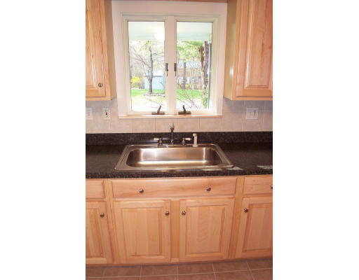 8 Skinners Road Groton, MA 01450 - Photo 5 of 21 a kitchen with a sink and cabinets
