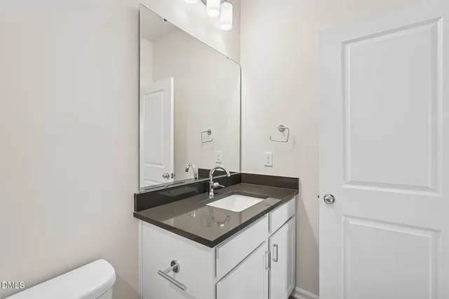 a kitchen with a stove and a refrigerator