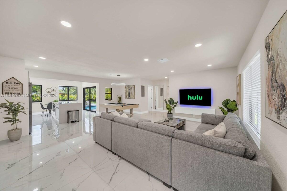 305 Northwest 124th Street North Miami, FL 33168 - Photo 13 of 41 a living room with furniture and a flat screen tv