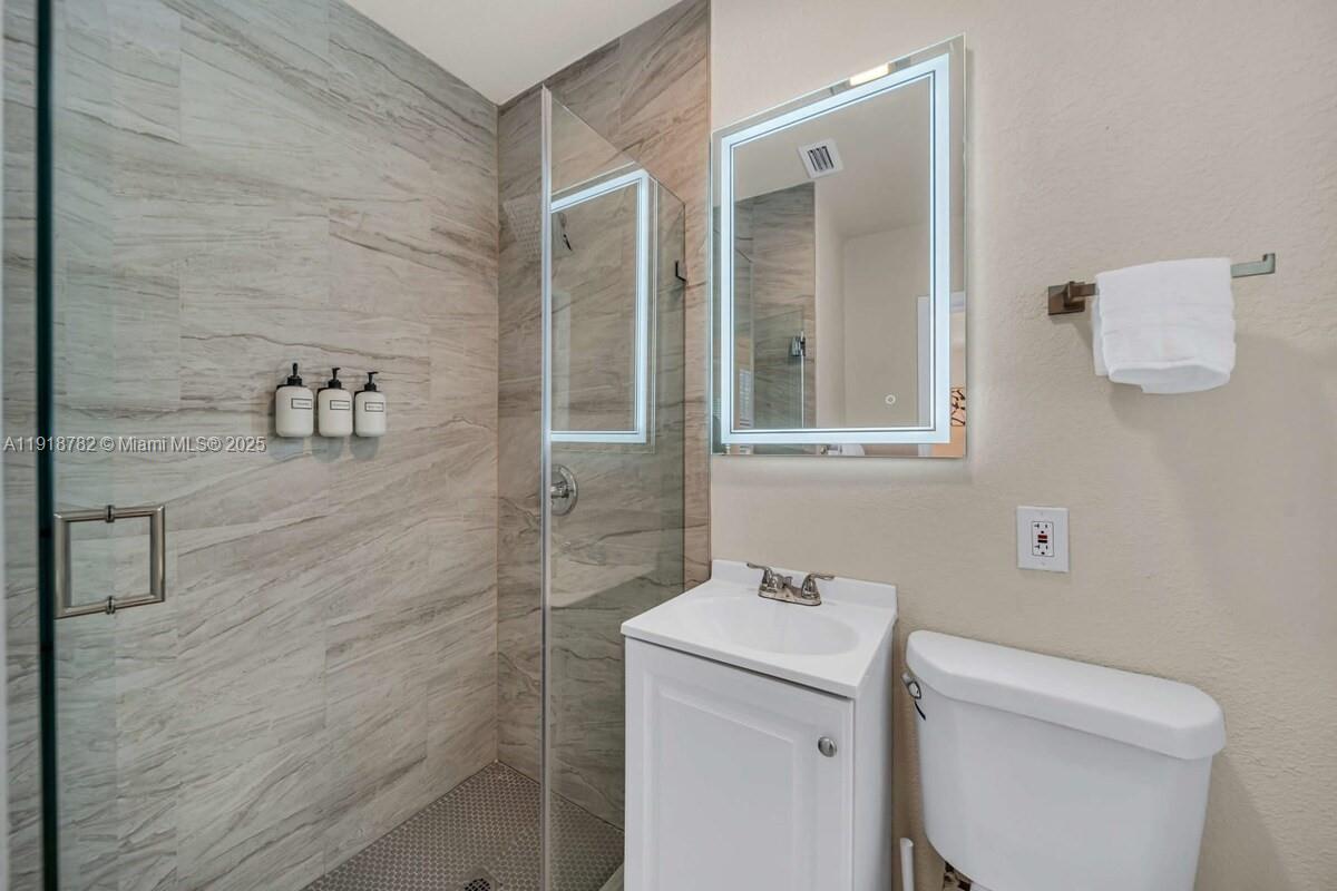 305 Northwest 124th Street North Miami, FL 33168 - Photo 20 of 41 a bathroom with a sink and a toilet