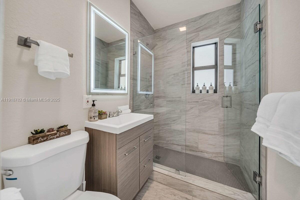 305 Northwest 124th Street North Miami, FL 33168 - Photo 23 of 41 a bathroom with a sink toilet and shower