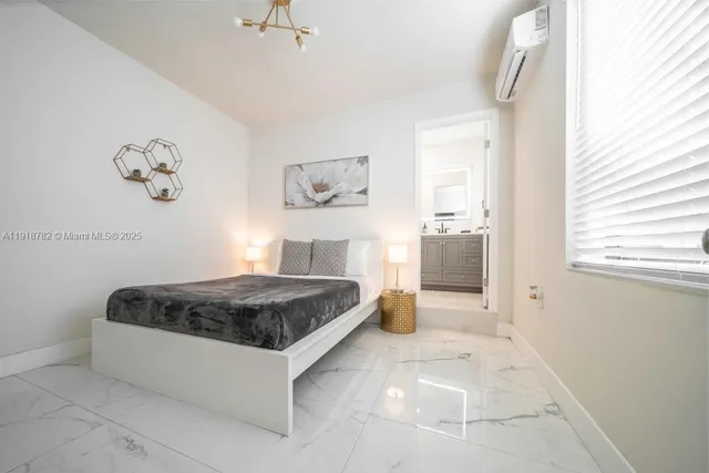 a spacious bedroom with a bed and a cabinets