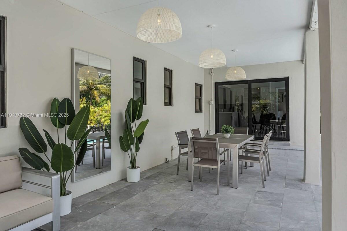 305 Northwest 124th Street North Miami, FL 33168 - Photo 34 of 41 a dining room with furniture and a potted plant