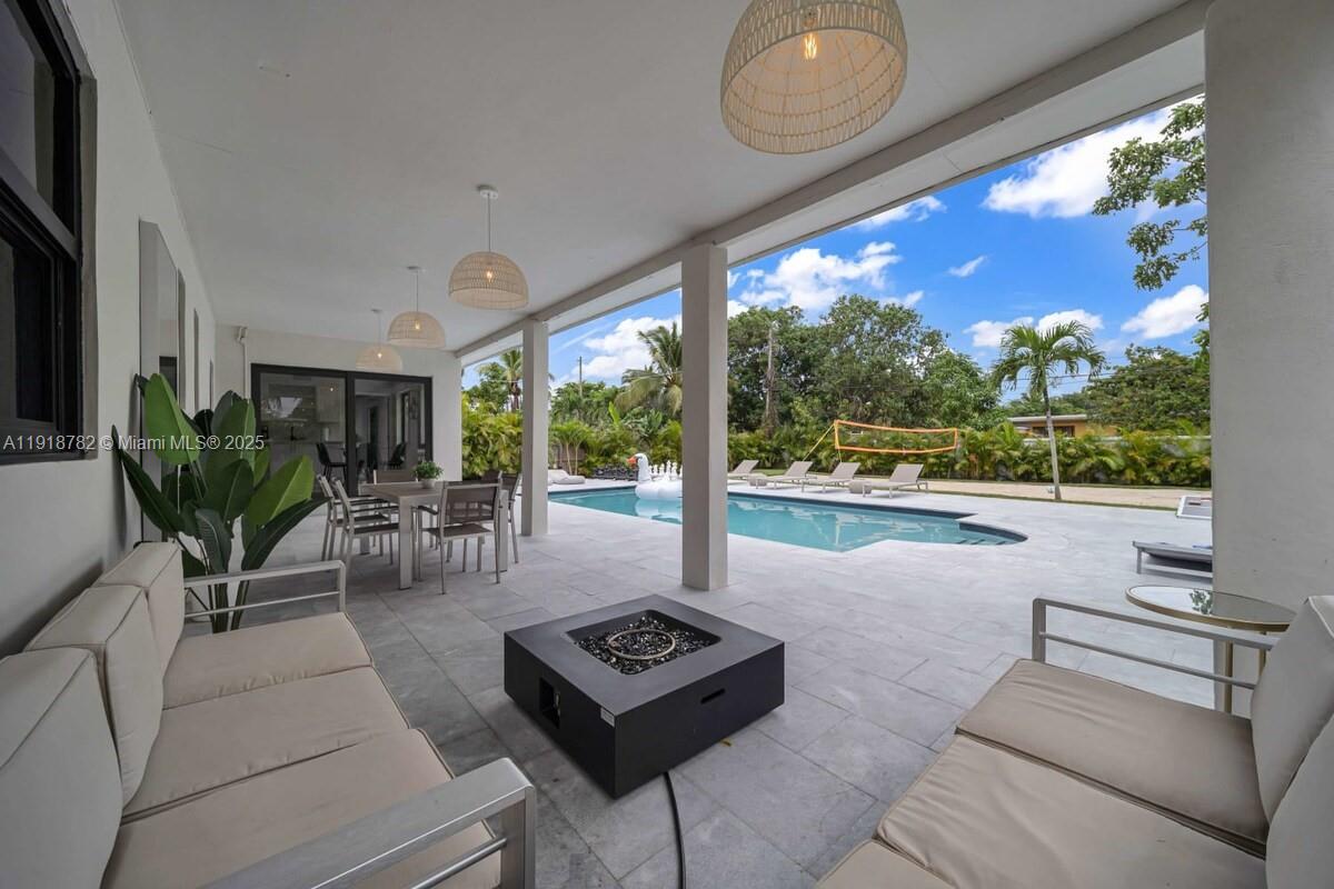 305 Northwest 124th Street North Miami, FL 33168 - Photo 35 of 41 a living room with furniture and a floor to ceiling window