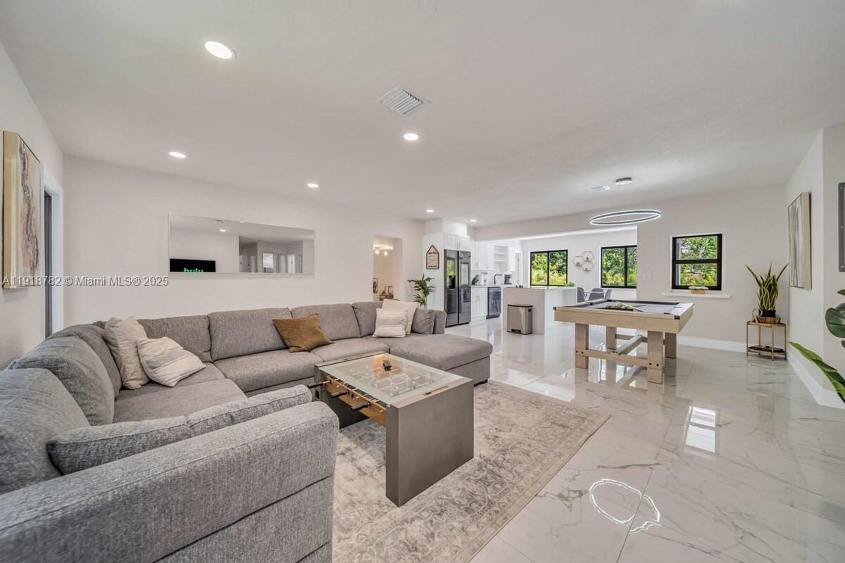 305 Northwest 124th Street North Miami, FL 33168 - Photo 5 of 41 a living room with furniture and view of kitchen