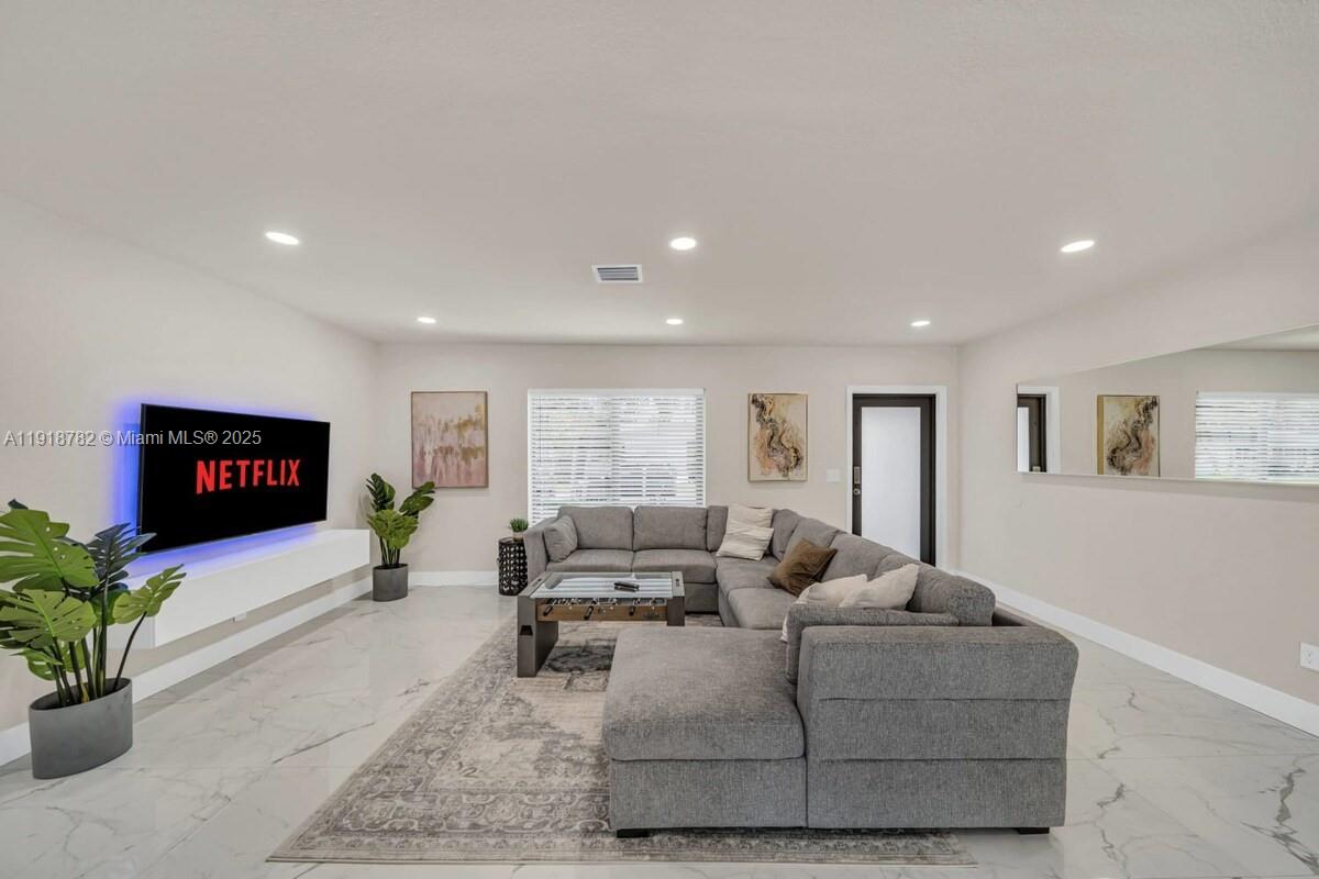 305 Northwest 124th Street North Miami, FL 33168 - Photo 6 of 41 a living room with furniture and a flat screen tv