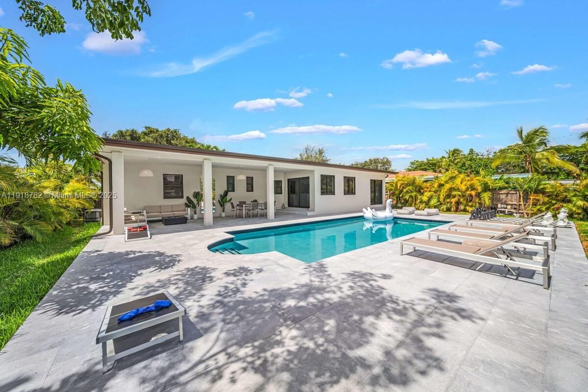 305 Northwest 124th Street North Miami, FL 33168 - Photo 9 of 41 a house with garden in front of it