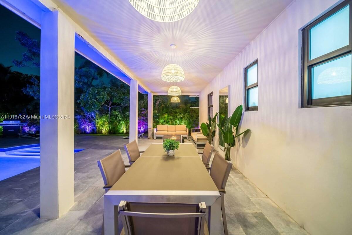 305 Northwest 124th Street North Miami, FL 33168 - Photo 10 of 41 a view of a dining room with furniture window and wooden floor