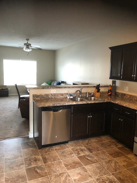 435 Kubota Drive Murfreesboro, TN 37128 - Photo 6 of 8 a kitchen with stainless steel appliances granite countertop a sink stove and cabinets