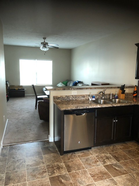 435 Kubota Drive Murfreesboro, TN 37128 - Photo 7 of 8 a kitchen with stainless steel appliances granite countertop a sink and a stove